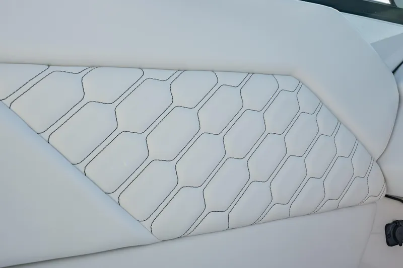 Slide: The Image of 2026 Four Winns H1 OB boat interior with hexagonal stitched white upholstery. - 25