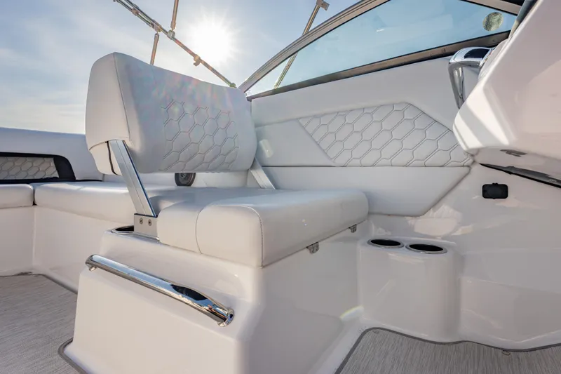 Slide: The Image of 2026 Four Winns H1 OB boat interior with white seating and modern design elements. - 19