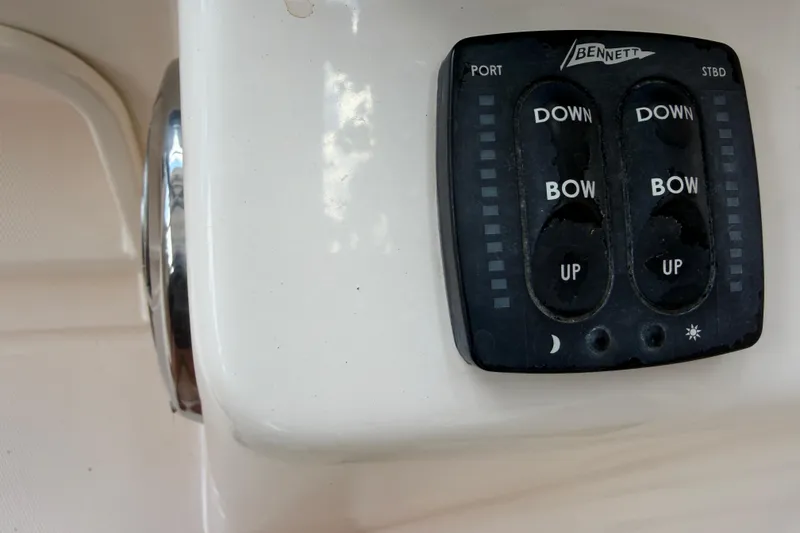 Slide: The Image of Bennett trim tab control panel on 2014 Grady-White Freedom 275 boat. - 18