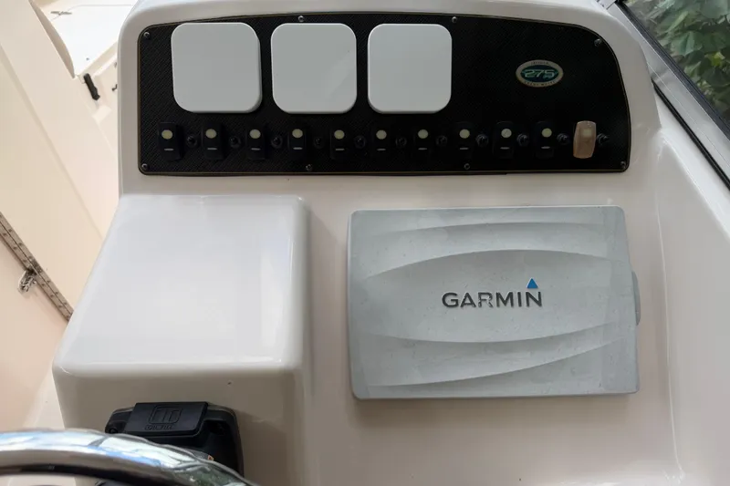 Slide: The Image of Control panel of a 2014 Grady-White Freedom 275 boat with Garmin navigation system. - 24