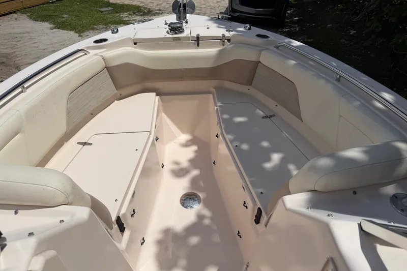 Slide: The Image of 2014 Grady-White Freedom 275 boat interior with spacious seating and storage compartments. - 27