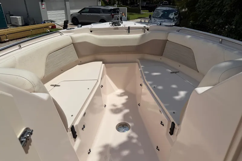 Slide: The Image of 2014 Grady-White Freedom 275 boat interior with spacious seating and storage compartments. - 28