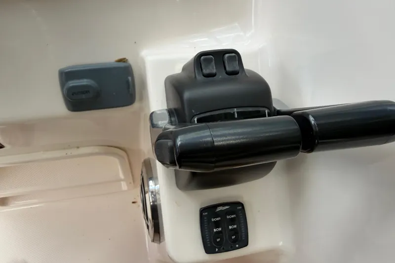 Slide: The Image of Close-up of 2014 Grady-White Freedom 275 boat controls and switches. - 33