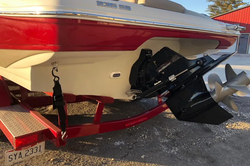 Slide: The Image of 2020 Crownline 235 SS boat on trailer, featuring MerCruiser engine and Ohio license plate. - 10
