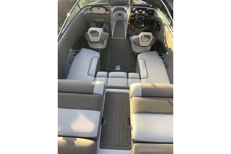 Slide: The Image of Interior of 2020 Crownline 235 SS boat with spacious seating and modern dashboard. - 27