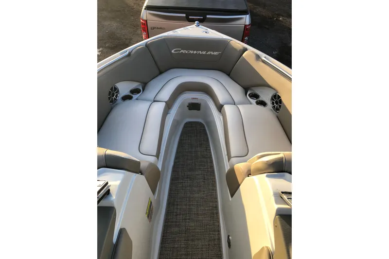 Slide: The Image of Interior view of a 2020 Crownline 235 SS boat with cushioned seating. - 30