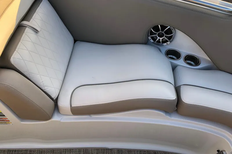 Slide: The Image of 2020 Crownline 235 SS boat interior with cushioned seating and speaker system. - 35