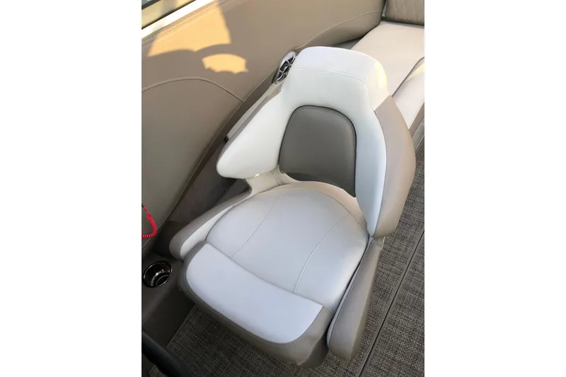 Slide: The Image of 2020 Crownline 235 SS boat seat with beige and white upholstery. - 39