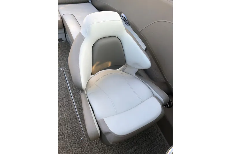 Slide: The Image of 2020 Crownline 235 SS boat seat with gray and white upholstery. - 40