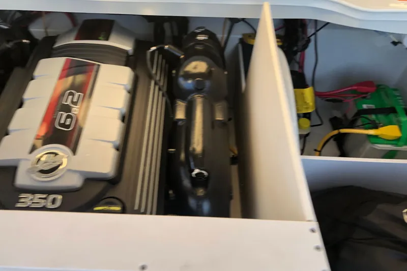 Slide: The Image of Engine compartment of a 2020 Crownline 235 SS boat, featuring a 6.2L engine. - 42