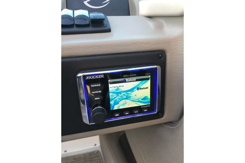 Slide: The Image of Kicker media center with Bluetooth on 2020 Crownline 235 SS boat dashboard. - 45