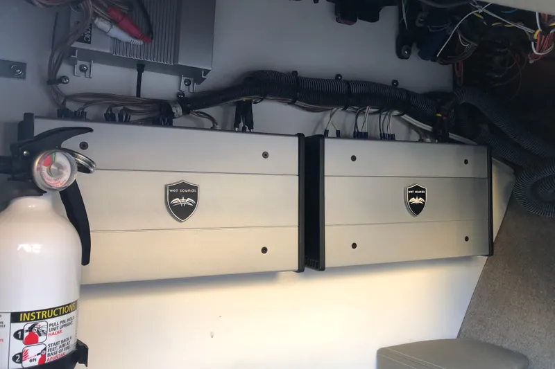 Slide: The Image of 2020 Crownline 235 SS boat audio system with Wet Sounds amplifiers and fire extinguisher. - 46
