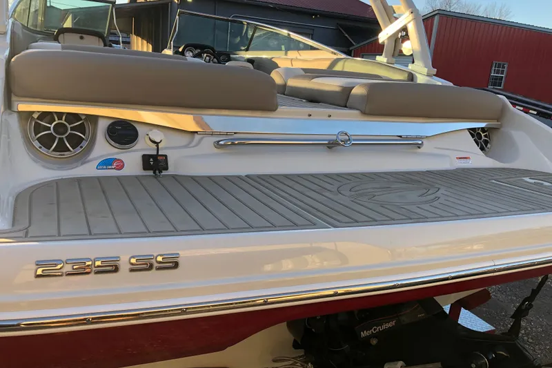 Slide: The Image of 2020 Crownline 235 SS boat rear view with seating and speakers. - 49