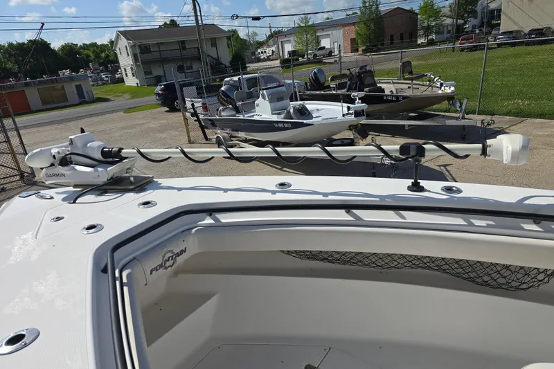Slide: The Image of 2006 Fountain 23 Center Console boat with Garmin equipment, parked outdoors. - 19