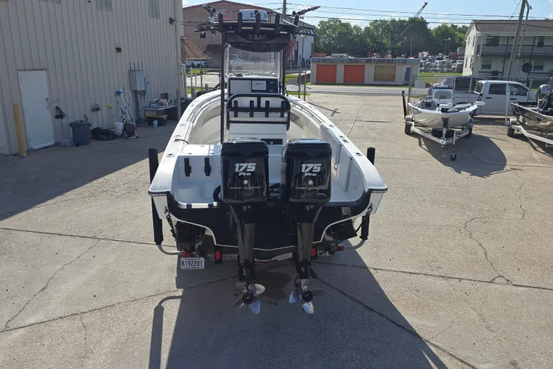 Slide: The Image of 2006 Fountain 23 Center Console boat with dual 175 Pro engines in a marina. - 4