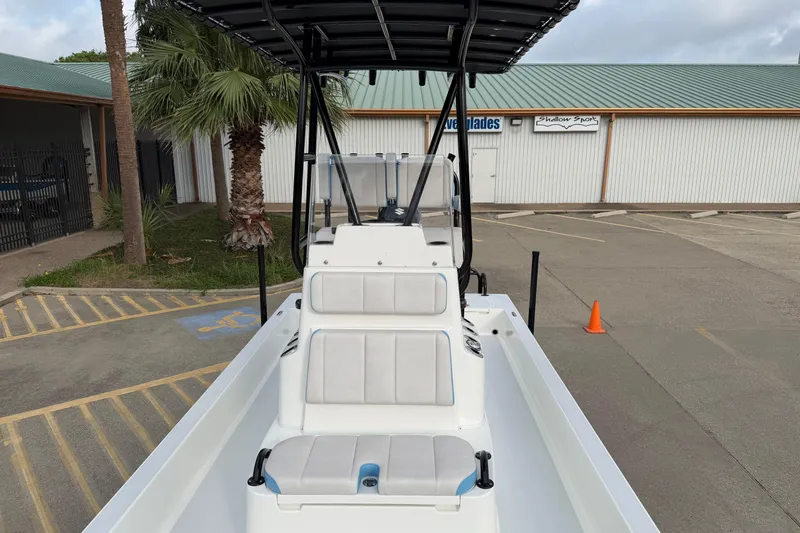 Slide: The Image of 2026 Shallow Sport 22 Sport boat parked, featuring sleek design and comfortable seating. - 10