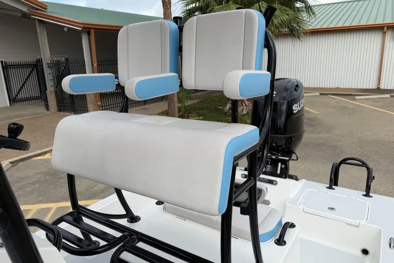 Slide: The Image of 2026 Shallow Sport 22 Sport boat seating with blue and white upholstery. - 13