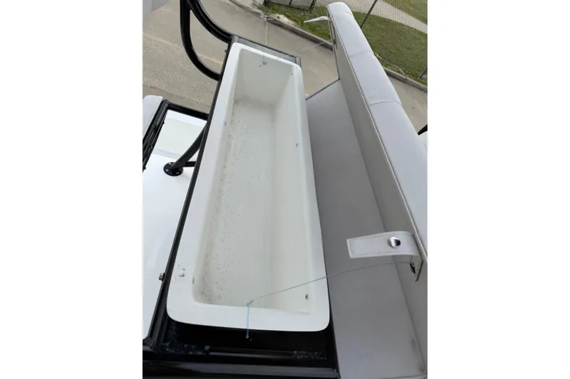 Slide: The Image of Shallow Sport 22 Sport 2026 boat storage compartment with cushioned seating. - 15