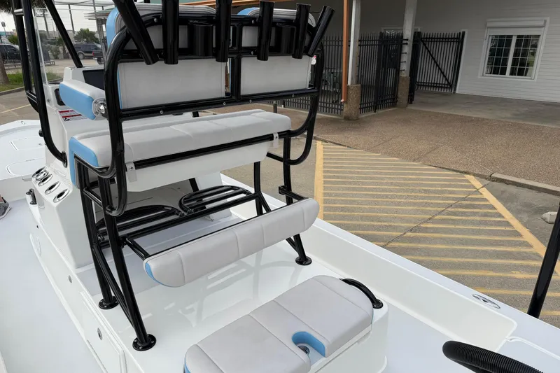 Slide: The Image of 2026 Shallow Sport 22 Sport boat interior with seating and rod holders. - 17