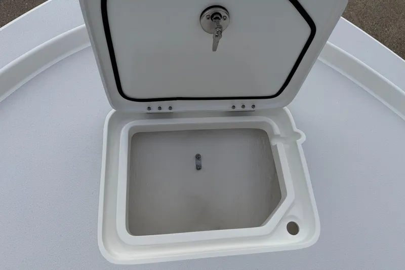 Slide: The Image of Open storage compartment on 2026 Shallow Sport 22 Sport boat deck. - 9