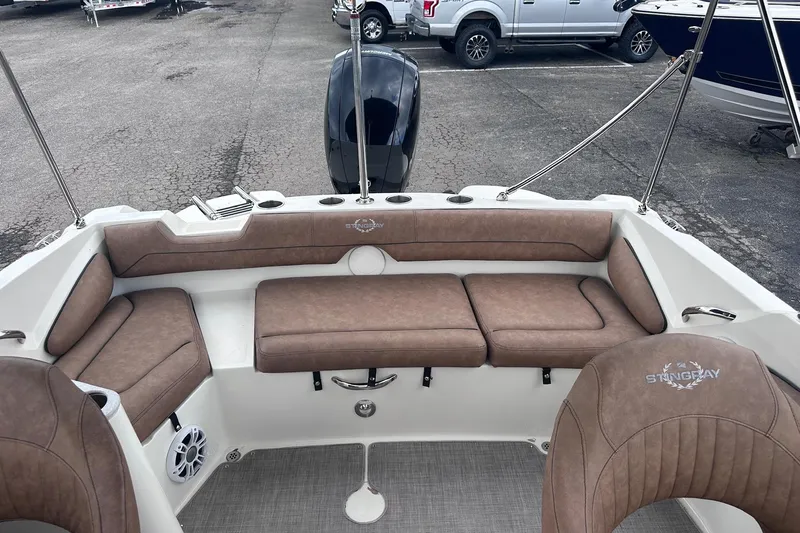 Slide: The Image of Interior of 2022 Stingray 201 DC boat with brown seating and modern design. - 7