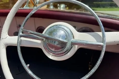Slide: The Image of Vintage 1952 Chris-Craft 18 Runabout steering wheel with classic design elements. - 19