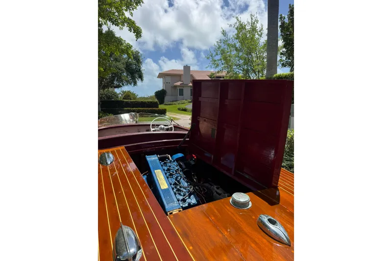 Slide: The Image of 1952 Chris-Craft 18 Runabout with open engine compartment, showcasing classic wooden design. - 23