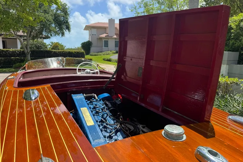 Slide: The Image of 1952 Chris-Craft 18 Runabout with open engine compartment, showcasing classic wooden design. - 24
