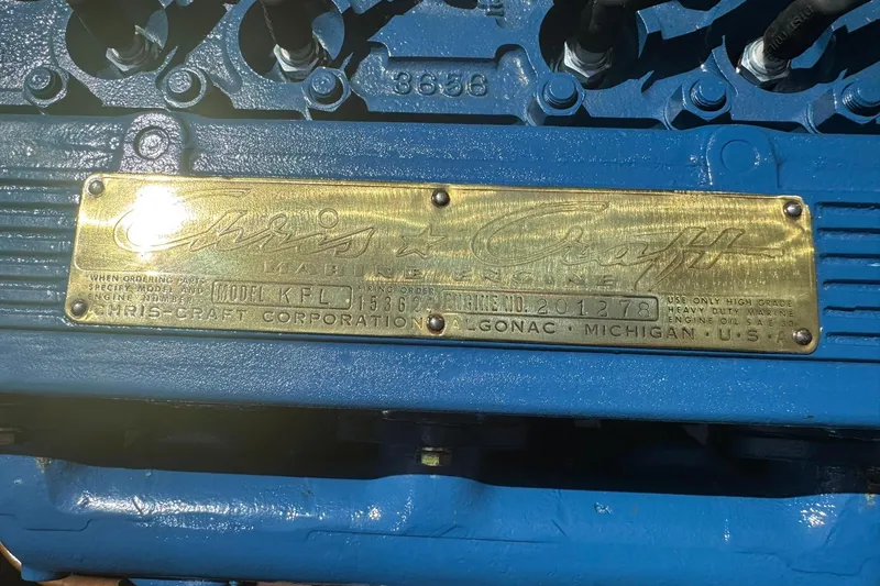 Slide: The Image of 1952 Chris-Craft 18 Runabout engine plate, blue engine, brass label, Algonac, Michigan. - 28