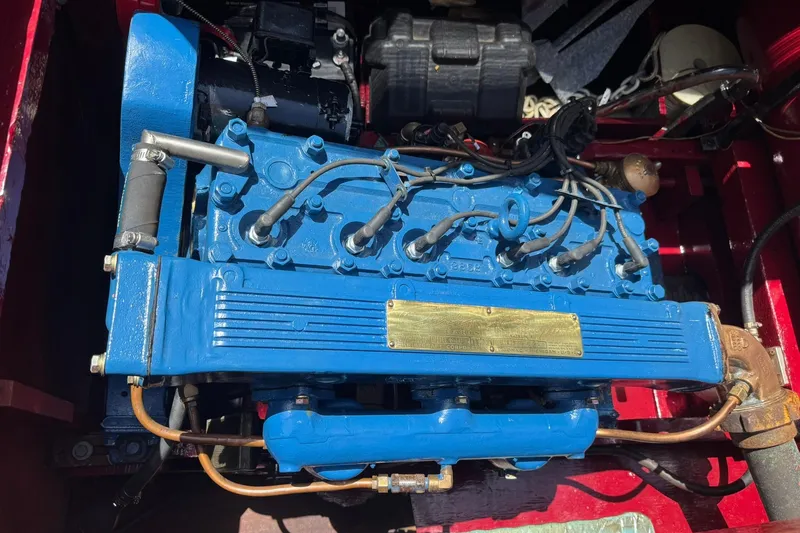 Slide: The Image of 1952 Chris-Craft 18 Runabout engine, vibrant blue, detailed view. - 30