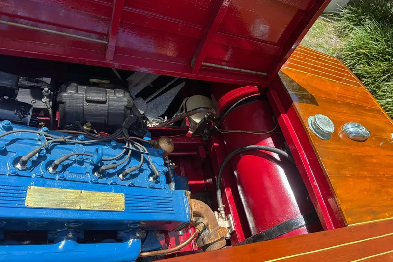 Slide: The Image of 1952 Chris-Craft 18 Runabout engine compartment with blue engine and red interior detailing. - 31