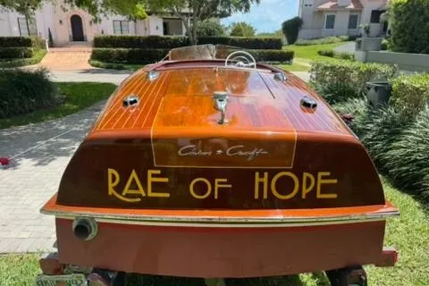 Slide: The Image of 1952 Chris-Craft 18 Runabout boat named "Rae of Hope" with polished wood finish. - 5