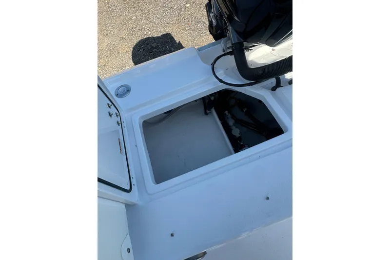 Slide: The Image of Open storage compartment on 2026 Action Craft 22 Bay boat, showcasing interior details. - 15