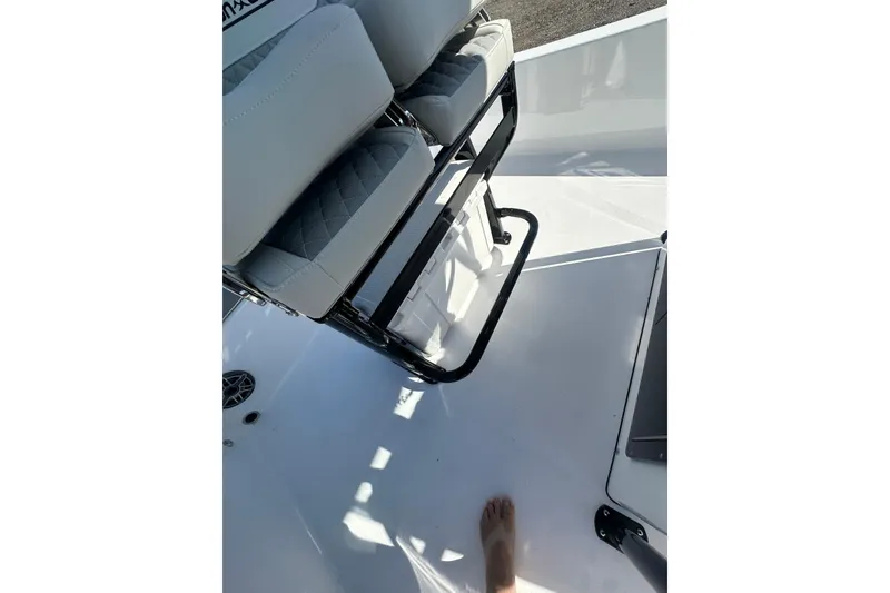 Slide: The Image of Interior of 2026 Action Craft 22 Bay boat, featuring seating and deck details. - 21