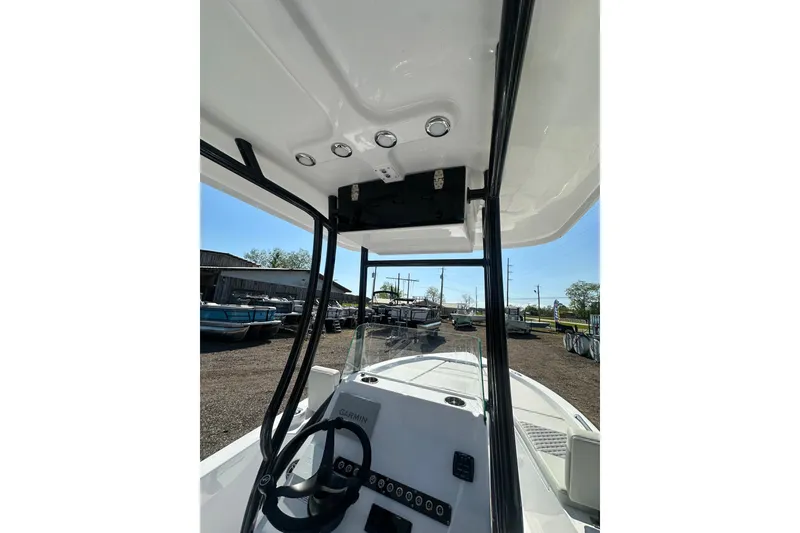 Slide: The Image of 2026 Action Craft 22 Bay boat interior with steering wheel and control panel. - 24