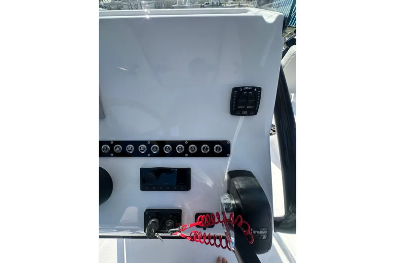 Slide: The Image of Control panel of 2026 Action Craft 22 Bay boat with switches and gauges. - 25