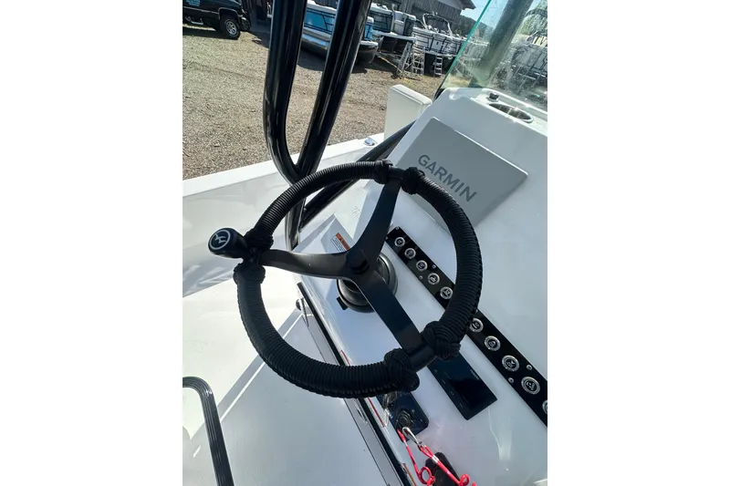 Slide: The Image of Steering wheel of 2026 Action Craft 22 Bay boat with Garmin navigation system. - 27