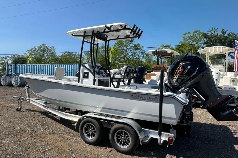 Slide: The Image of 2026 Action Craft 22 Bay boat on trailer with Yamaha engine, parked outdoors. - 3