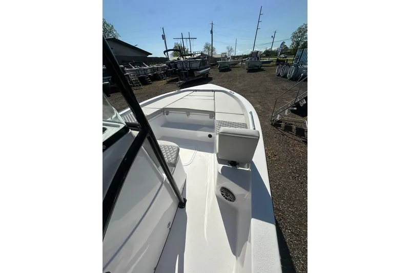 Slide: The Image of 2026 Action Craft 22 Bay boat, white deck, outdoor display, sunny day. - 31