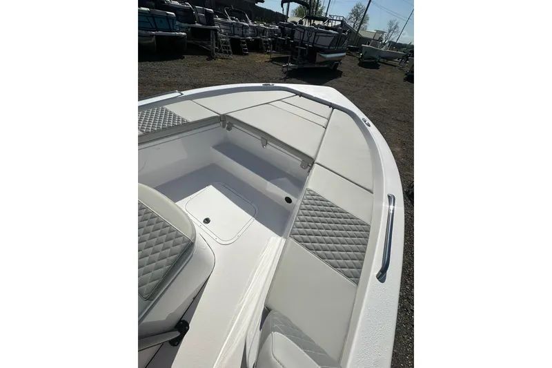 Slide: The Image of 2026 Action Craft 22 Bay boat interior with cushioned seating and storage compartments. - 32