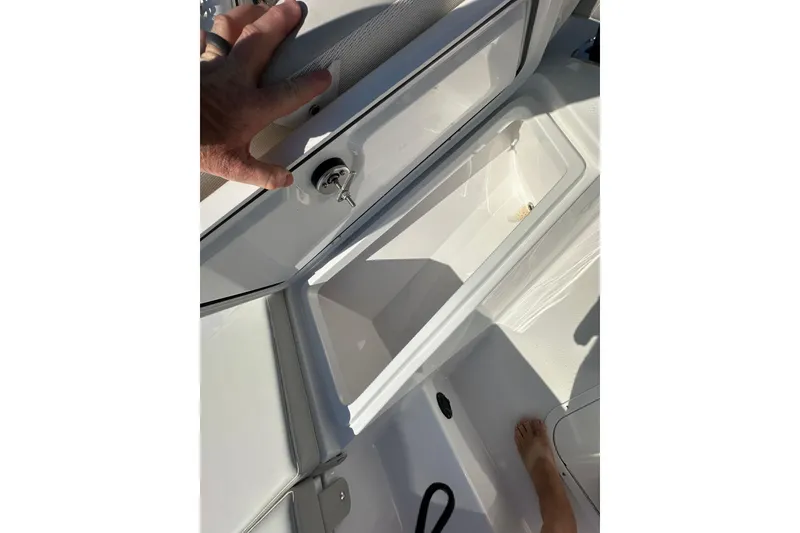 Slide: The Image of Open storage compartment on 2026 Action Craft 22 Bay boat, showing interior space. - 33