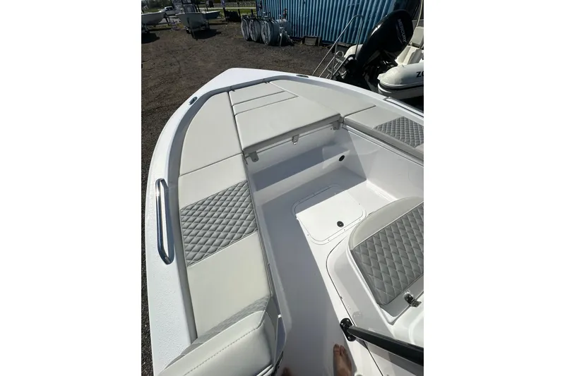 Slide: The Image of 2026 Action Craft 22 Bay boat interior with cushioned seating and storage compartments. - 41