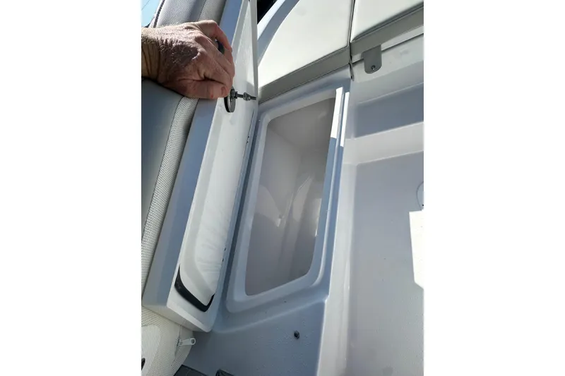 Slide: The Image of Open storage compartment on 2026 Action Craft 22 Bay boat, showcasing interior space. - 43