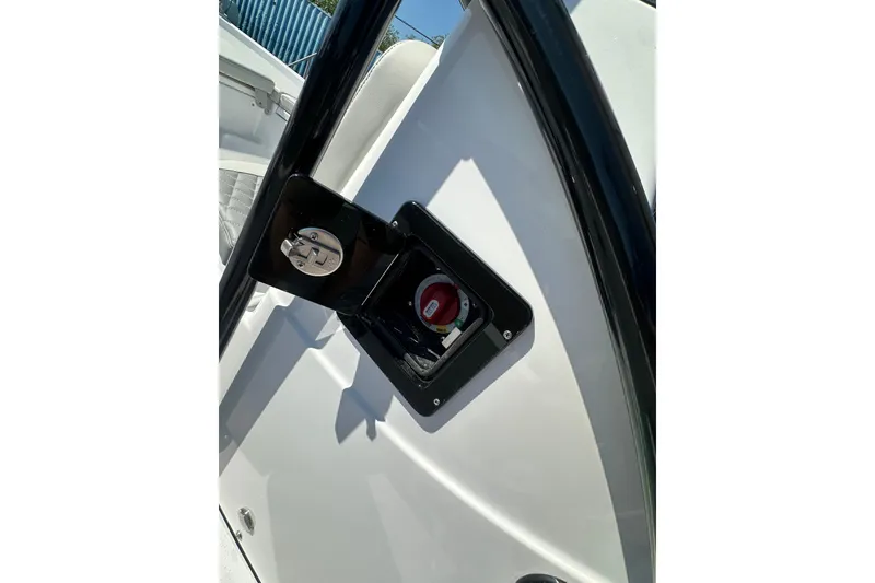 Slide: The Image of 2026 Action Craft 22 Bay boat ignition switch and control panel close-up. - 44