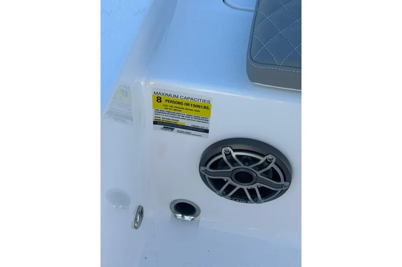 Slide: The Image of 2026 Action Craft 22 Bay boat interior with speaker and capacity label for 8 persons. - 49