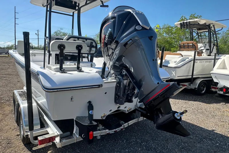 Slide: The Image of 2026 Action Craft 22 Bay boat with powerful outboard motor on trailer. - 5