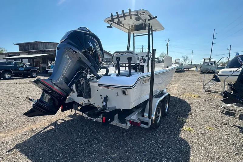 Slide: The Image of 2026 Action Craft 22 Bay boat with Yamaha engine on trailer in sunny outdoor setting. - 7