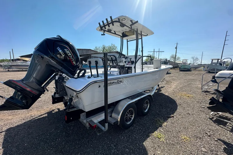 Slide: The Image of 2026 Action Craft 22 Bay boat on trailer with Yamaha engine in sunny outdoor setting. - 9