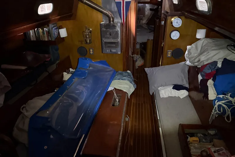Slide: The Image of Interior of a 1963 Hinckley Bermuda 40 sailboat with cozy cabin features. - 11