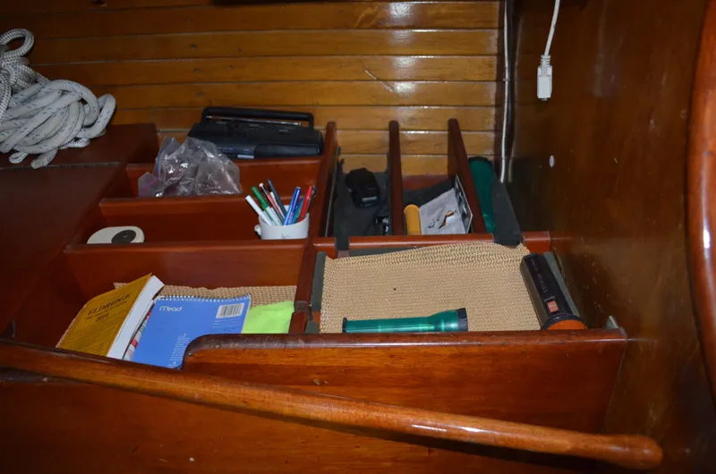 Slide: The Image of Interior of a 1963 Hinckley Bermuda 40 sailboat with storage and tools. - 13